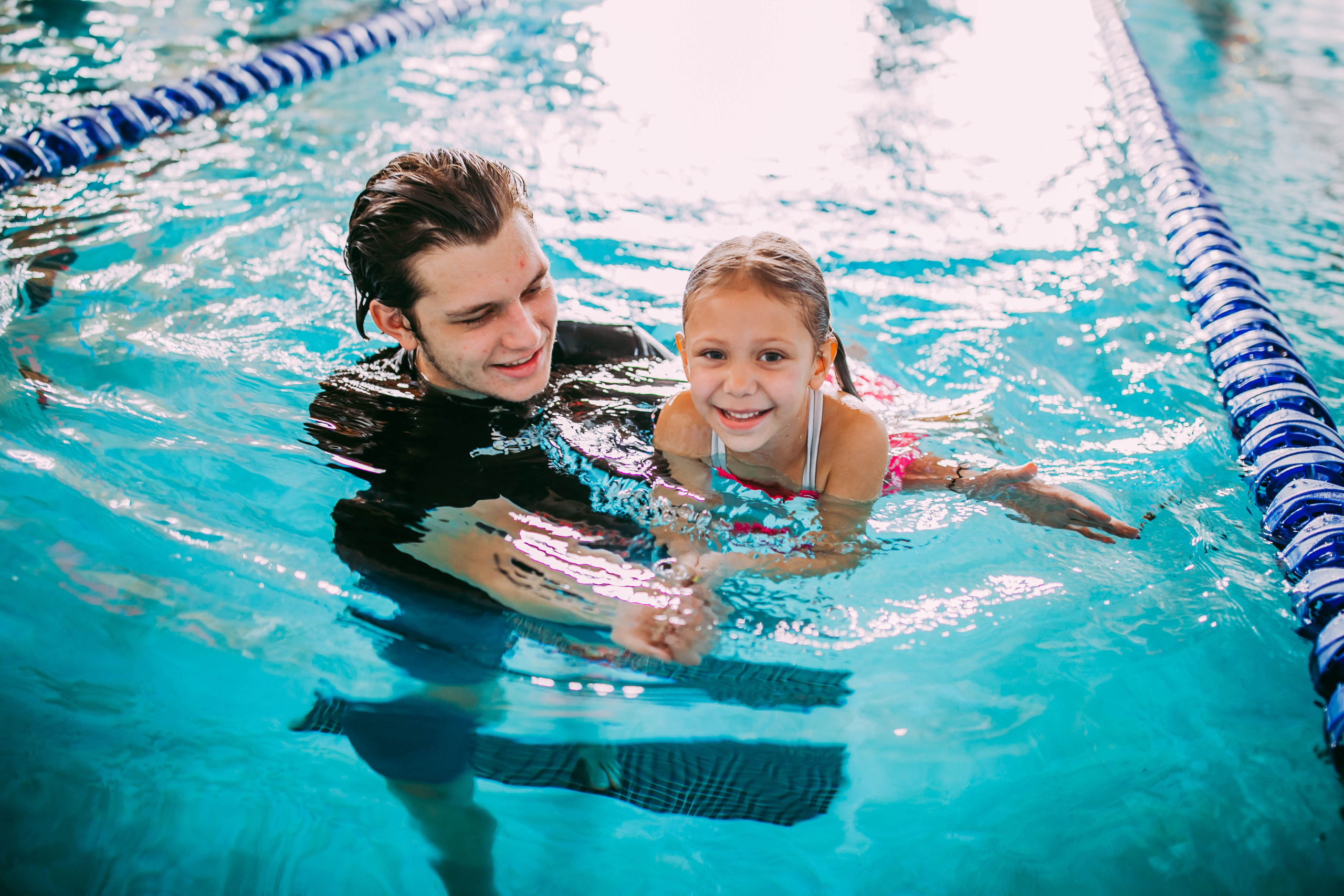 swimmer-instructor-8 swim teach and student doing back float